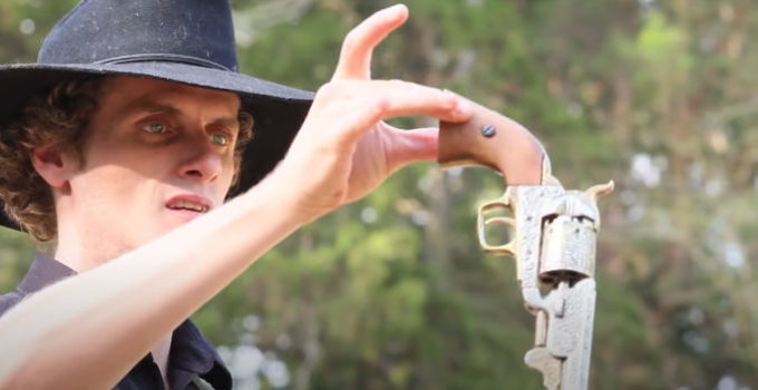 Christopher Bowman as William Bonney, pretending he's about to give up his gun in Billy the Kid, Showdown in Lincoln County (2017)