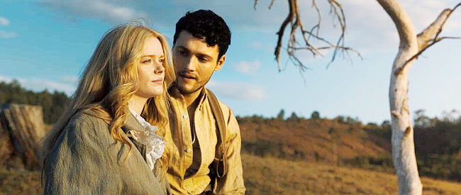 Tom Lewis as Michael showing Angel (Abigail Cowen) a sunset in Redeeming Love (2022)