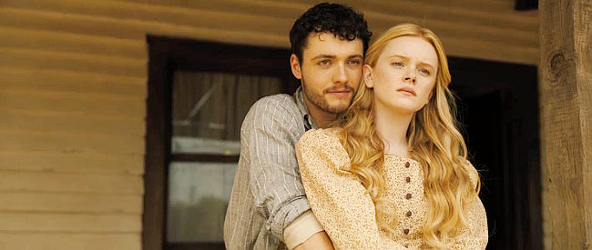 Tom Lewis as Michael with Abigail Cowen as Angel, on the porch of his farmhouse in Redeeming Love (2022)