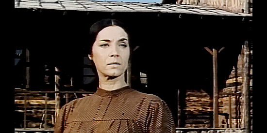 Eva Guerr as the twin's helper Maggie, watching them ride off in Two Guns for Two Twins (1966)