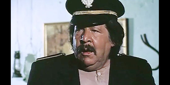 Fernando Sancho as Col. Jimenez, getting his first glimpse of the lovely Nora Winters in Fabulous Trinity (1972)