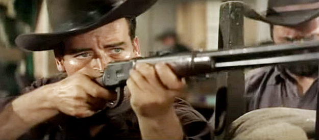 George Martin as Sgt. Matt Logan, taking aim during the climatic gun battle with the Radisson riders in Two Violent Men (1964)