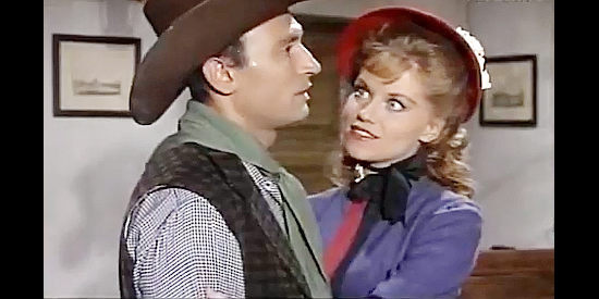 May Heatherly as Ruth, showing her appreciation to Tom for getting her uncle an extension on his loan in Torrejon City (1962)