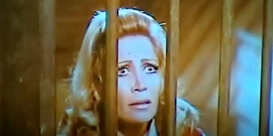 Monica Taber as Tex's fiance, finding herslf locked in a cell during a prison break in Let's Go and Kill Sartana (1971)