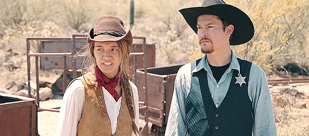 Olivia Hsu as Billie and Frank Prell as Sheriff Jack Barton, planning an attack on the vampires in Billie the Kid (2022)