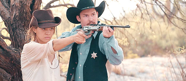 Olivia Hsu as Billie and Frank Prell as Sheriff Jack Barton, taking aim at a vampire in Billie the Kid (2022)