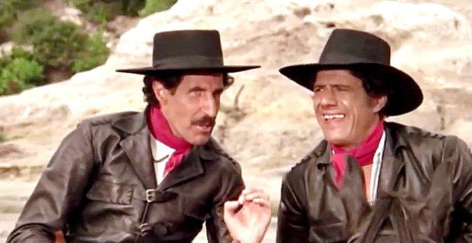 Ciccio Ingrassia as Gringo and Franco Franchi as Django debate which way to head after learning of Indio's whereabouts in Two Sons of Ringo (1966)