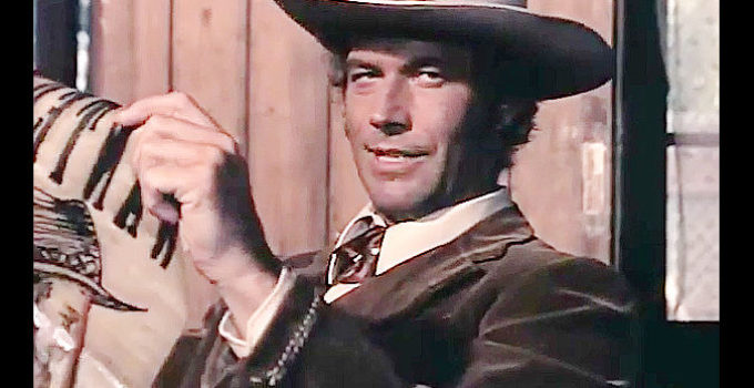 Richard Harrison as Scott, learning for a new bounty up for grabs in Fabulous Trinity (1972)