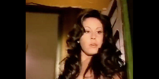 Paula Pattier as Moira, desperately trying to seduce the young man who's come into her home in If You Shoot ... You Live! (1975)