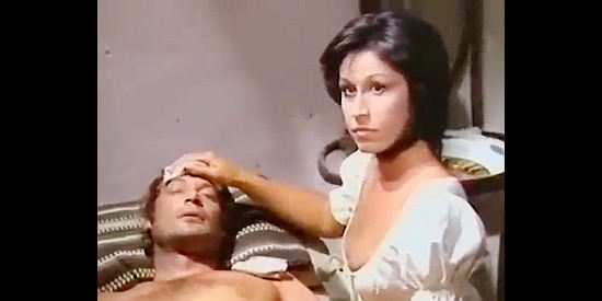 Paula Pattier as Moira, nursing Jimmy (Alejandro de Enciso), the young man her husband has brought into their home in If You Shoot ... You Live! (1975)