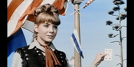 Pili (Pilar Bayona) as Jenny, presenting a card as a target for her sharp-shooting sister in Two Guns for Two Twins (1966)