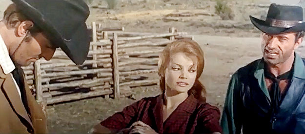 Raf Baldassarre as Bruce, reacts to Bill's claim that his last name is Smith while Dorothy (Mercedes Alonso) looks on in Son of Jesse James (1965)