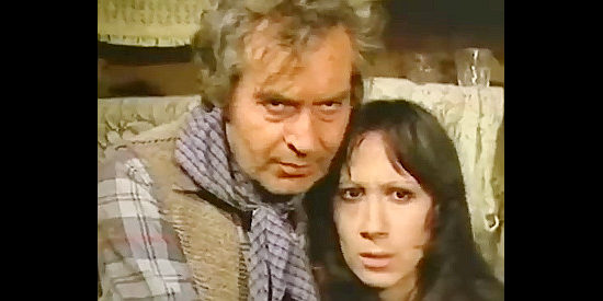 Rafael Vaquero as John and Maria Nevado as his wife Mary, farmer's Kramer and his men harass in If You Shoot ... You Live! (1975)