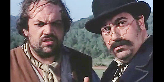Ricardo Palacios as Ray Wesley and Tita Garcia as his brother Charles, on the alert because of an approaching horse in Fabulous Trinity (1972)