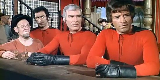 Sal Borgese as Sal, Frank Brana as Brad and George Martin as George, three supermen visiting the saloon in Three Supermen of the West (1973)