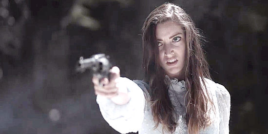 Emily Whitcomb as Harriet, proving an educated woman can handle a six-gun in The Legend of Hawes (2022)