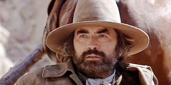 Gregory Peck as Arch Deans, watching out for trouble from a travois in Billy Two Hats (1975)