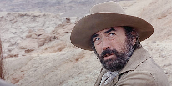 Gregory Peck as Arch Deans, wondering how he and Billy can escape their pursuers in Billy Two Hats (1975)