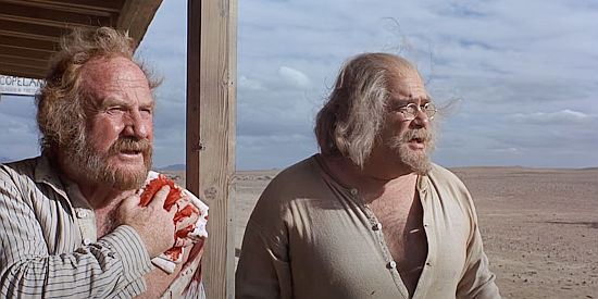 Jack Warden as Sheriff Henry Gifford and David Huddleston as Copeland, satisfied a buffalo gun has helped slow the outlaws in Billy Two Hats (1975)