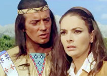 Pierre Brice as Winnetou comforting Karin Dor as Mabel Kingsley in Winnetou and Shatterhand in the Valley of Death (1968)