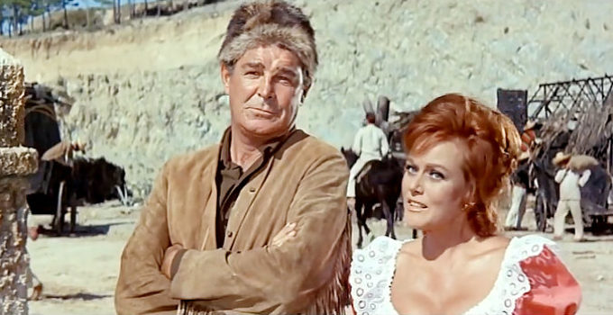 Rod Cameron as Old Firehand and Nadi Gray as Michele Mercier, rekindling a flame in Thunder at the Border (1966)