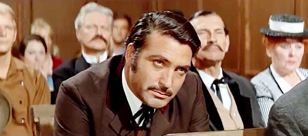 Rik Battaglia as Murdock, listening intently during court proceedings about the missing gold in Winnetou and Shatterhand in the Valley of Death (1968)