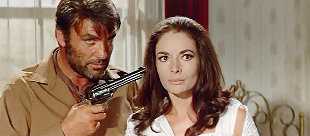 Rik Battaglia as Murdock, threatening Mabel Kingsley for a key piece of information in Winnetou and Shatterhand in the Valley of Death (1968)