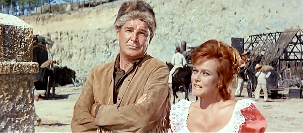 Rod Cameron as Old Firehand and Nadi Gray as Michele Mercier, rekindling a flame in Thunder at the Border (1966)