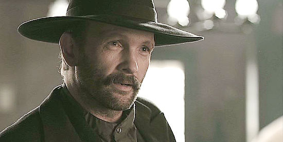 Andrew Howard as 'Bad' Frank Phillips, looking for information from a bartender in Hatfields & McCoys (2012)