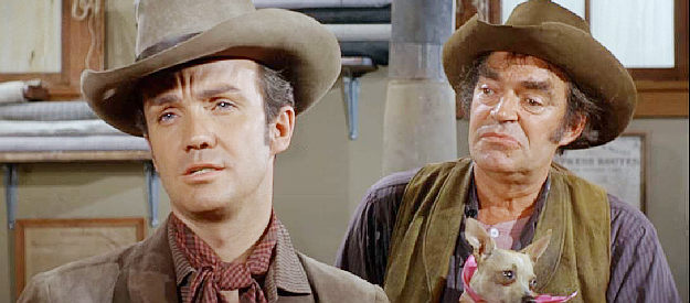 Ben Cooper as Colorado, a local gunman confronting Latigo while Jug May (Jack Elam) looks on in Support Your Local Gunfighter (1971)