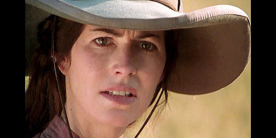 Dana Delany as Sarah McClure, fleeing a Comanche war party in True Women (1997)