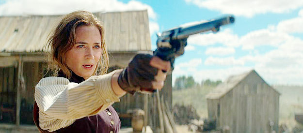 Emily Blunt as Cornelia Locke, with a pistol on a man who intended to rape her in The English (2022)