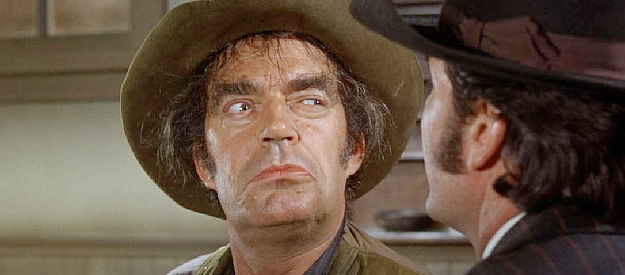 Jack Elam as Jug May, the drunk who befriends Latigo and winds up pretending to be a hired gun in Support Your Local Gunfighter (1971)