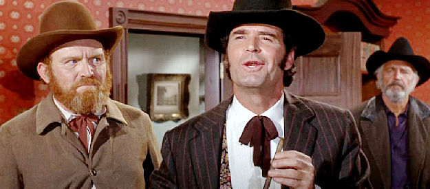 James Garner as Latigo, making a point with Col. Ames while Butcher (Gene Evans) looks on in Support Your Local Gunfighter (1971)