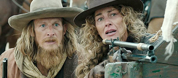James Landry Hebert as Wade and Faith Hill as Margaret Dutton, watching a Sioux war party approach in 1883 (2021-22)