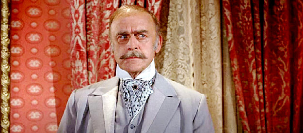 John Dehner as Col. Ames, one of the two men competing for the mining bonanza in Purgatory in Support Your Local Gunfighter (1971)