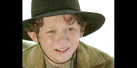 Jonathan Tucker as Moses Junior, one of Moses' many kids in The Fight Before Christmas (1994)