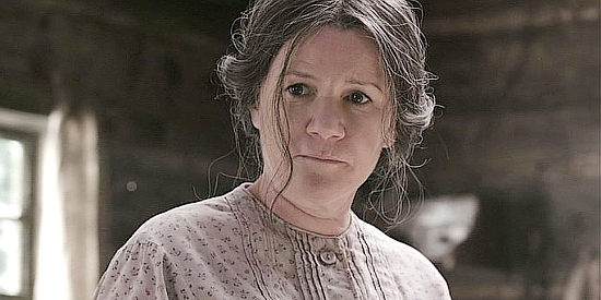 Mare Winningham as Sally McCoy, devoted to her husband Randall in Hatfields & McCoys (2012)