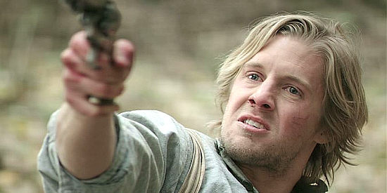 Matt Barr as Johnse Hatfield, pleading for his life with McCoys family members in Hatfields & McCoys (2012)