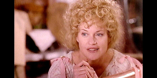 Melanie Griffith as Dora DuFran, offering some love advice to Calamity Jane in Buffalo Girls (1995)