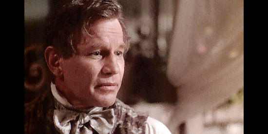 Michael York as Lewis Lawshe, trying to quiet Georgia's concerns about her heritage in True Women (1997)