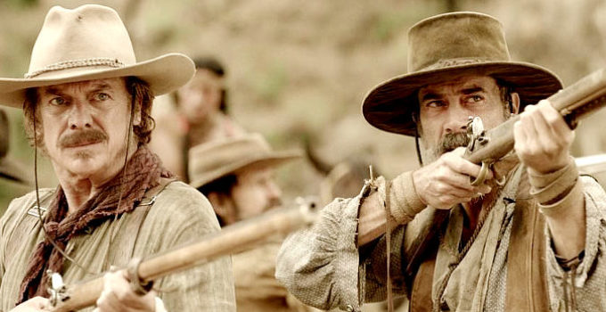 Christopher McDonald as Henry Karnes and Jeffrey Dean Morgan as Deaf Smith, leaders of the rangers in Texas Rising (2015)