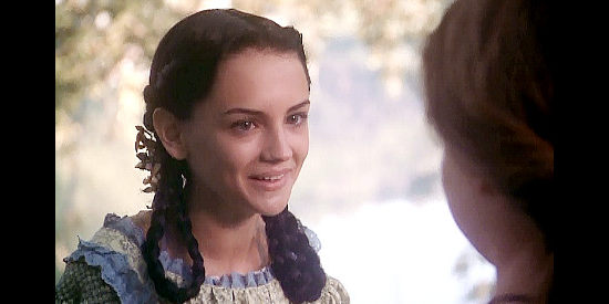 Rachael Leigh Cook as young Georgia, bragging about her influence over her father in True Women (1997)