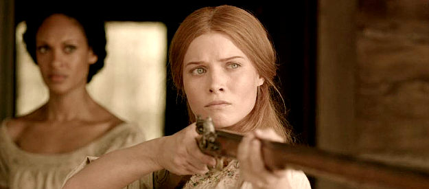 Sarah Jones as Pauline Wykoff, the woman who loses her husband and children to a Comanche raid in Texas Rising (2015)