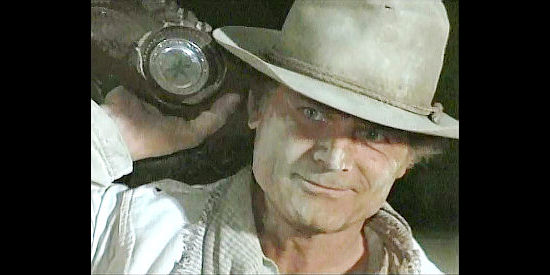 Terence Hill as Travis, contemplating a jailbreak for his brother in The Fight Before Christmas (1994)