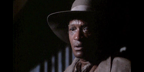 Tony Todd as Ed Tom, Georgia's longtime slave and the man she trusts with her cotton crop in True Women (1997)