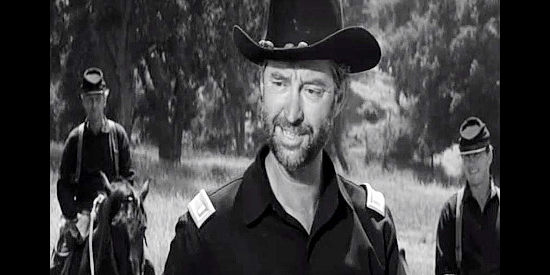James Griffith as Hugo Zattig, dressed in a Union uniform and deciding he might keep the gold for himself in Advance to the Rear (1964)
