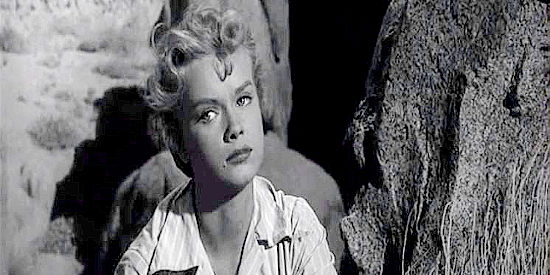 Anne Francis as Ellen Beldon, reflecting on a marriage that ended badly in The Hired Gun (1957)