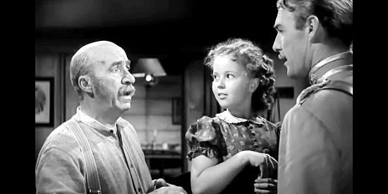 J. Farrell MacDonald as Pat O'Hannegan, Shirley Temple as Susannah Sheldon and Randolph Scott as Agnus 'Monty' Montague in Susannah of the Mounties (1939)