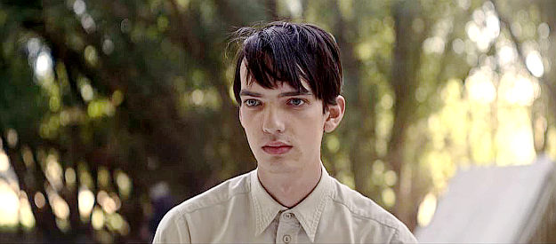 Kodi Smit-McPhee as Peter Gordon, surprised by Phil Burbank's sudden interest in his welfare in The Power of the Dog (2021)